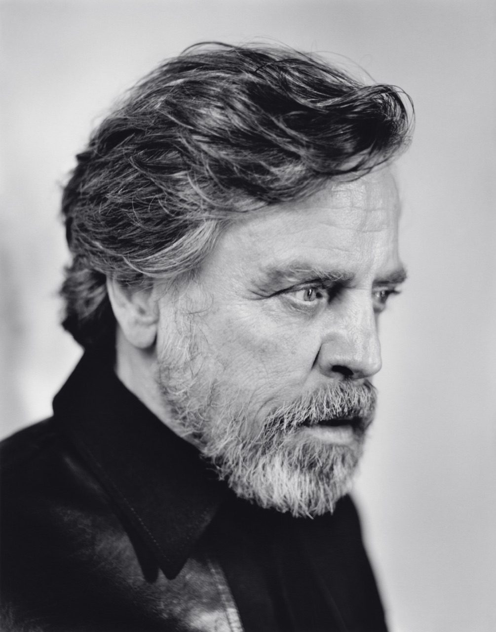 Black and white studio portrait of Mark Hamill