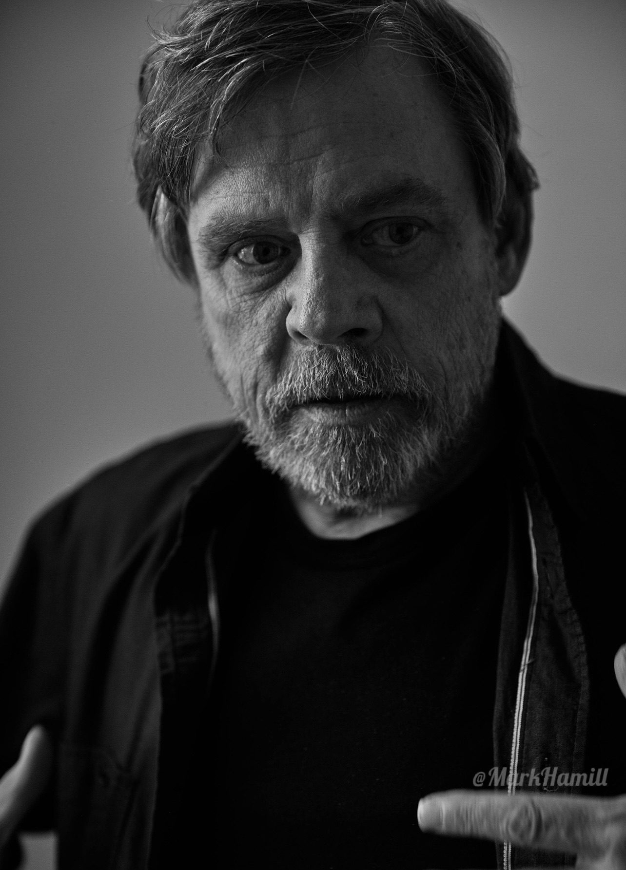 Mark Hamill in a dark studio portrait