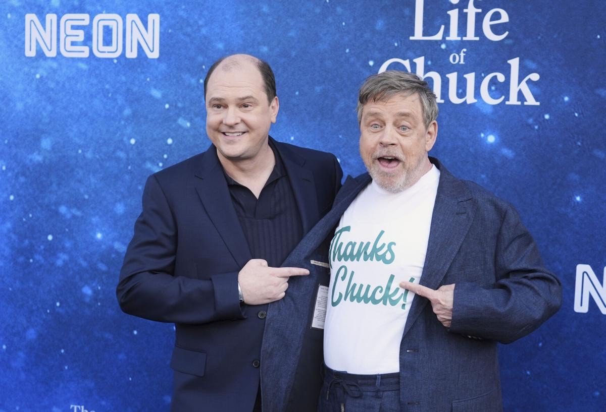 Mark Hamill and a fellow actor at a premiere backdrop